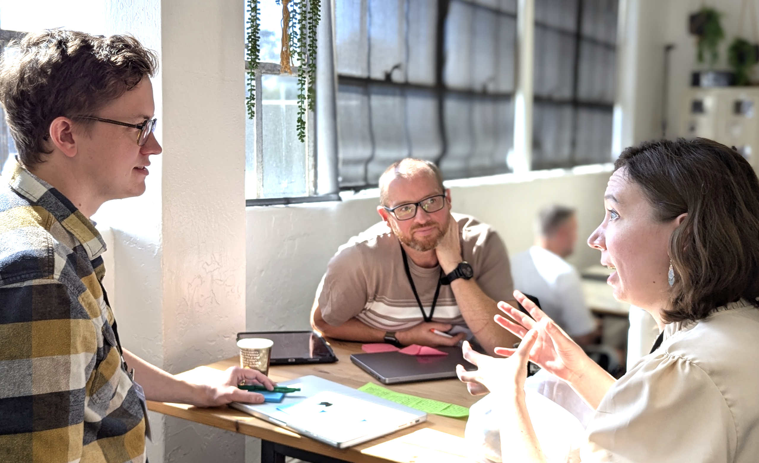 Working together in small groups on various ideas. Left to right: Franklin Koch, John Kaye, and Rose Reatherford.